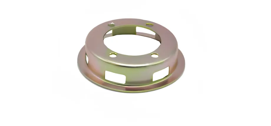 A gold-toned, zinc-plated circular stamped metal part featuring rectangular side vents and top mounting holes.