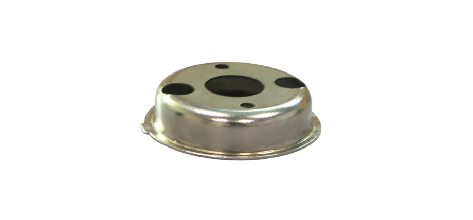 A small, polished silver metal cap with three circular holes on the top surface and a flanged base.