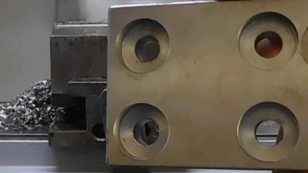 Four large-sized spotface holes in a thick sheet