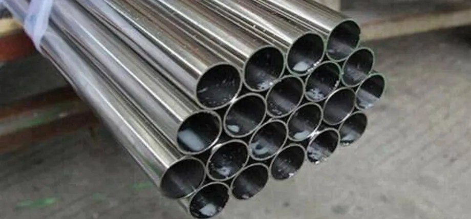 A large bundle of thin-walled stainless steel tubes stacked together, showing their hollow circular cross-sections