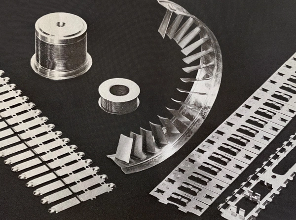Precision-machined aerospace metal components, including turbine blades and engine parts