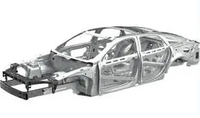 Bare metal car body frame without exterior panels or paint.