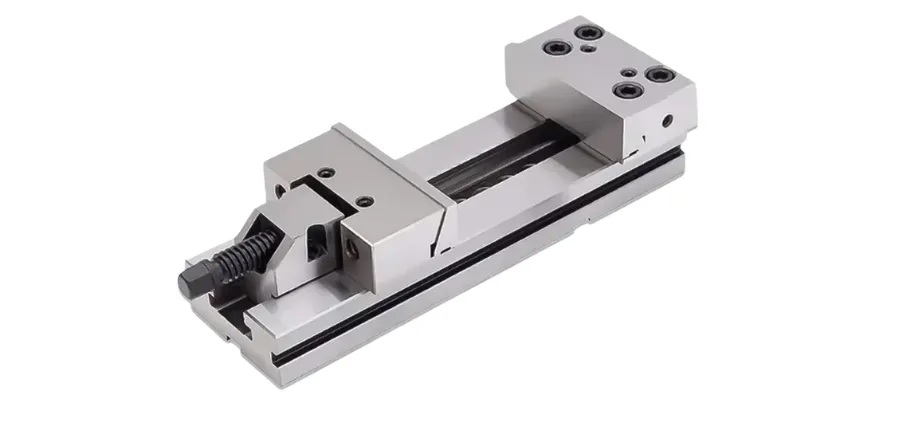 A studio shot of a heavy-duty, silver steel precision machine vise with a screw mechanism on a clean white background.