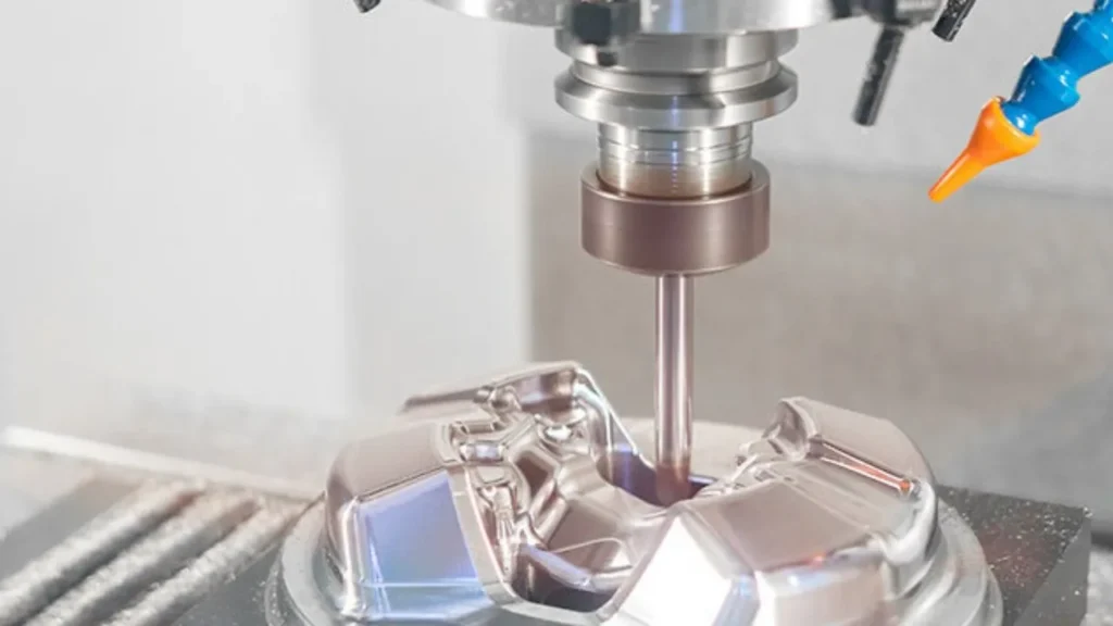 CNC milling machine cutting a precision metal part for the medical industry