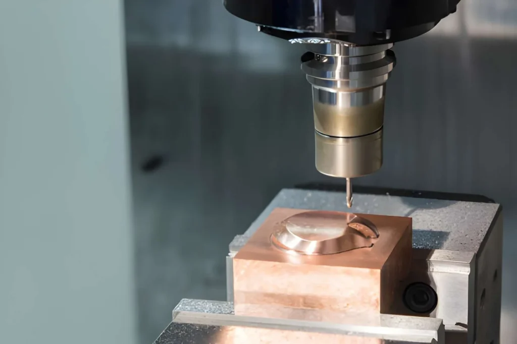 CNC milling machine cutting copper parts in operation for precision machining.