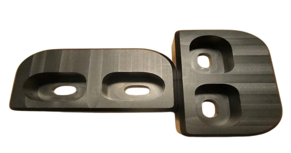 An image of a machined finish of two Delrin machined parts