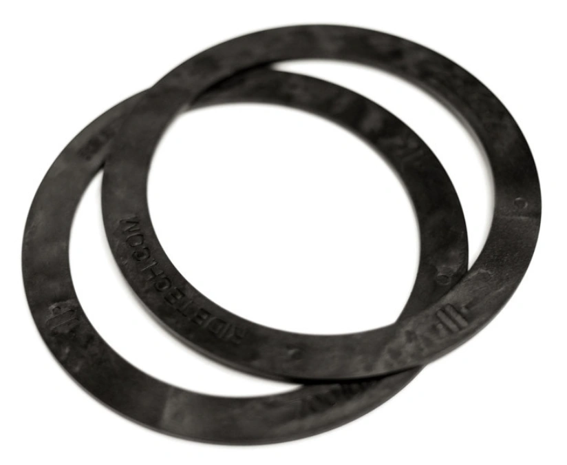 Two black Delrin spring washers overlapping on a white background.
