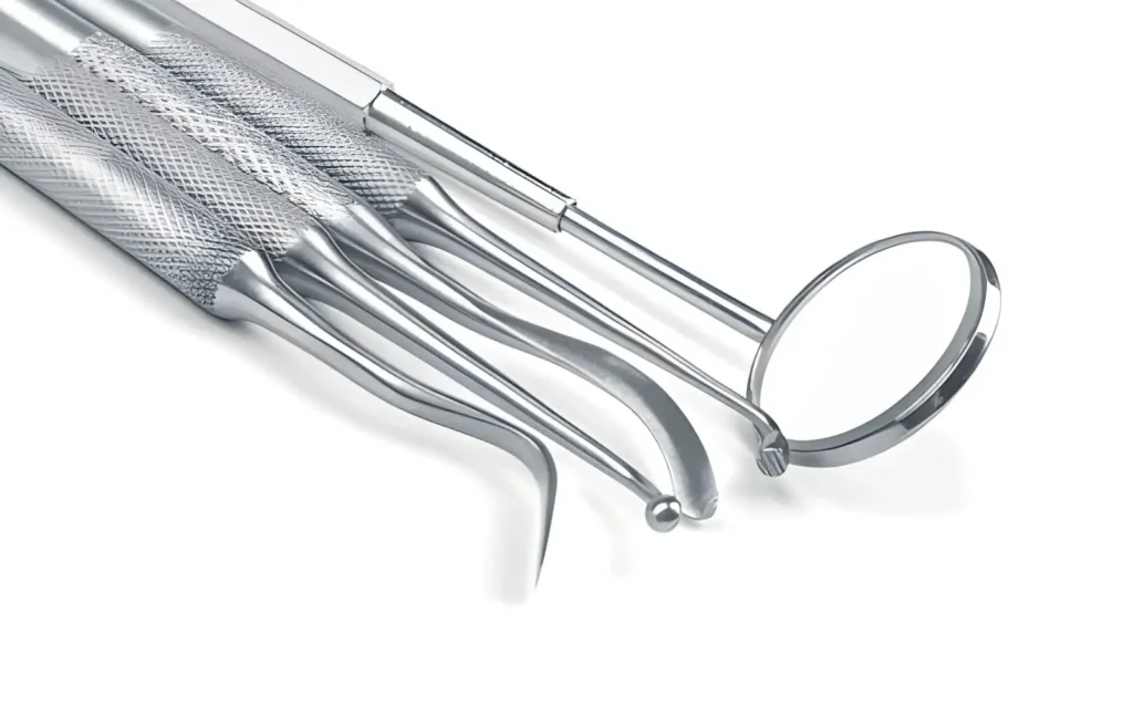 Image of metal dental care tools used in dentistry, showing precision-machined stainless steel instruments