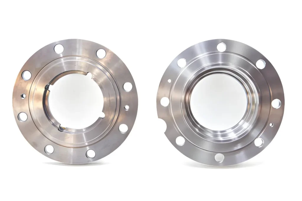 The image shows flat steel flanges isolated on a plain background. These components are used in piping and structural assemblies to securely connect sections