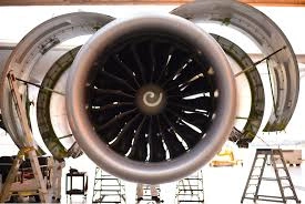 Jet engine fan blades on a commercial aircraft undergoing maintenance in a hangar