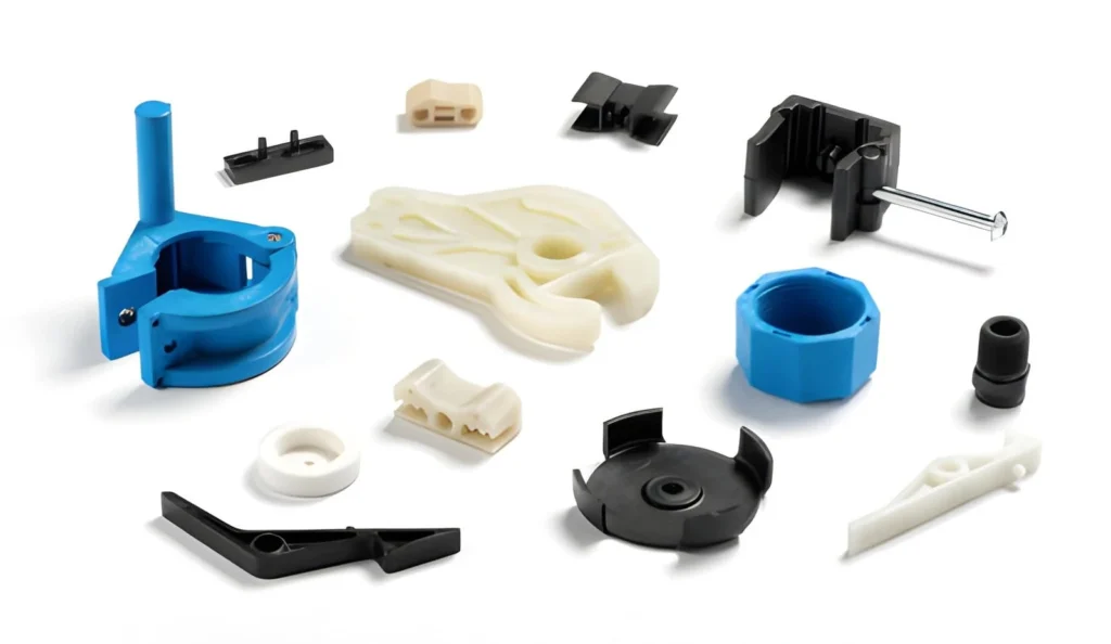 Assorted intricate plastic parts produced via low-volume injection molding.