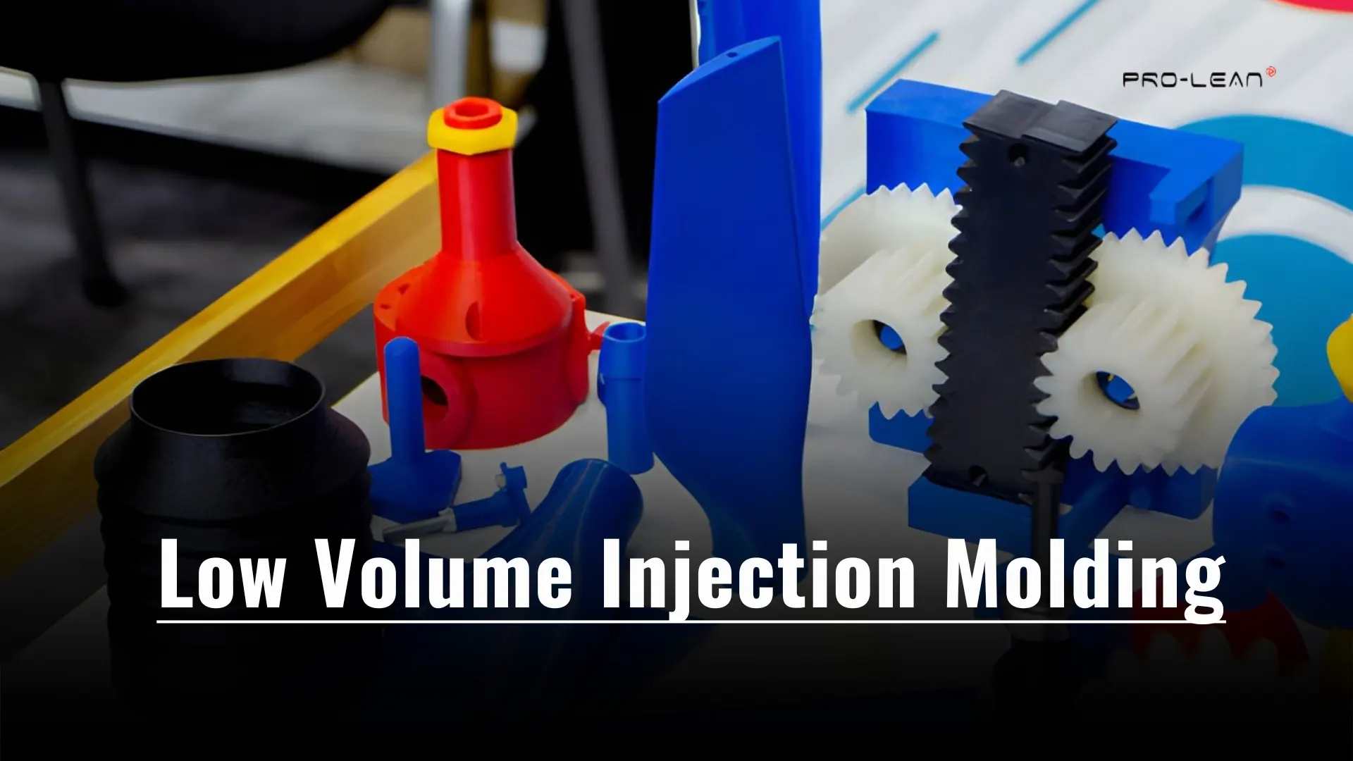 Colourful plastic parts produced using low-volume injection molding with overload text.