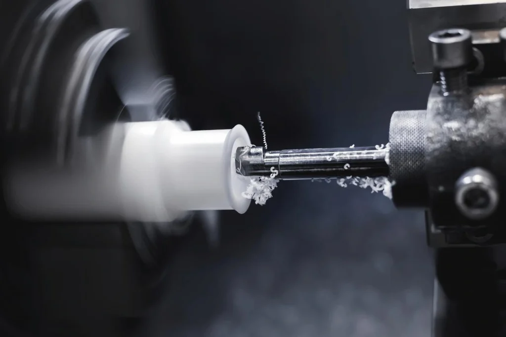 A carbide cutting tool performing a Nylon turning operation