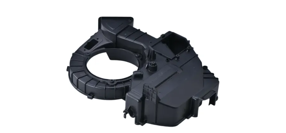 A complex, custom-engineered black plastic injection molded component designed with a circular opening for automotive or mechanical assemblies.