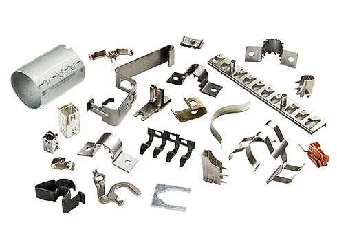 Collection of various small stamped metal components in different shapes and finishes.