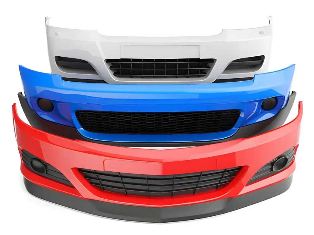 Stacked car bumpers in red, white, and blue made of impact-resistant plastic