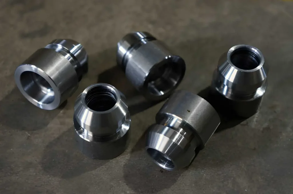 The image shows a stainless steel nipple adapter fitting used for hydraulic connections. 
