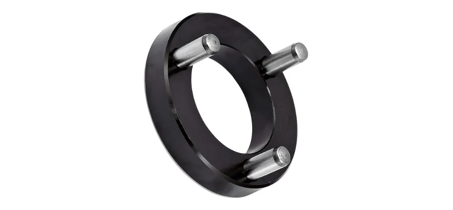 A black circular steel fixture ring featuring three evenly spaced silver locating pins extending outward.