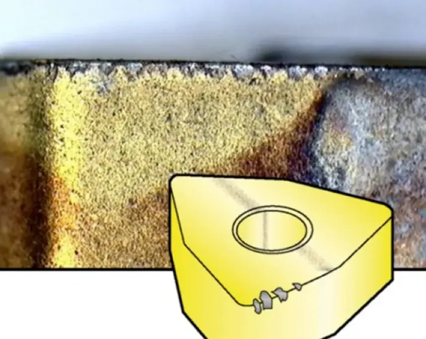 Macro photo of carbide cutting insert showing edge chipping damage alongside illustration of a triangular indexable insert.
