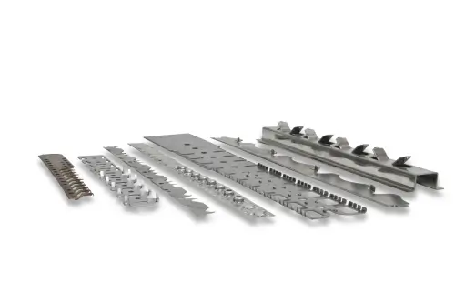 Different metal strips and parts produced through progressive stamping are arranged side by side.