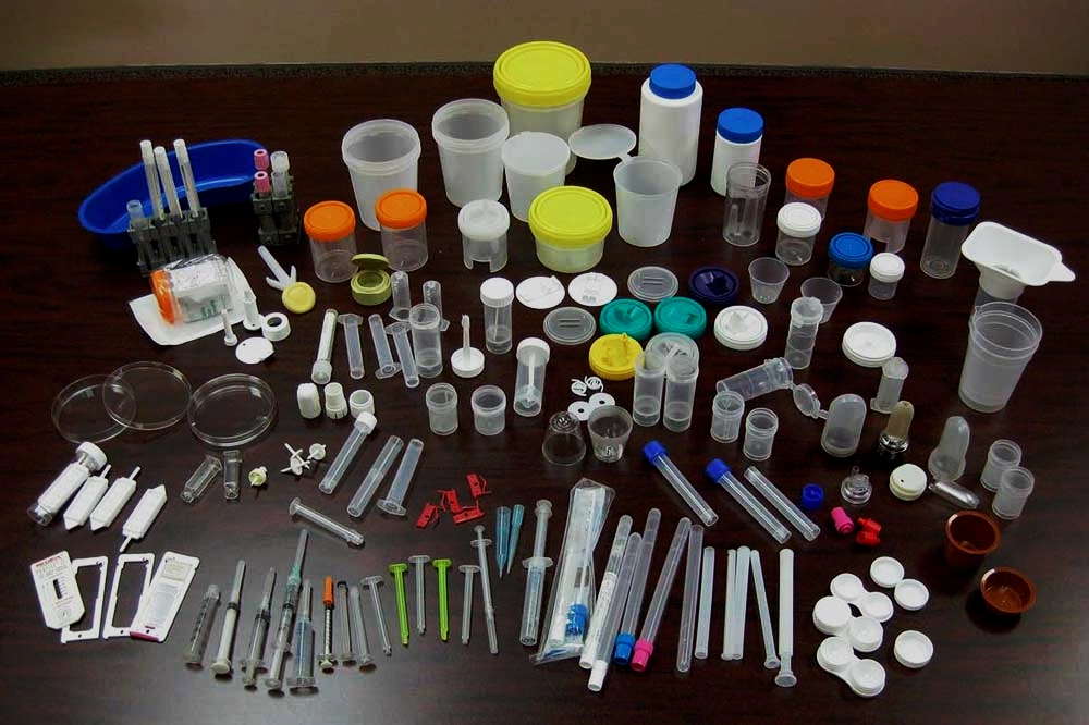 Assorted plastic medical devices, including syringes, containers, and specimen tubes