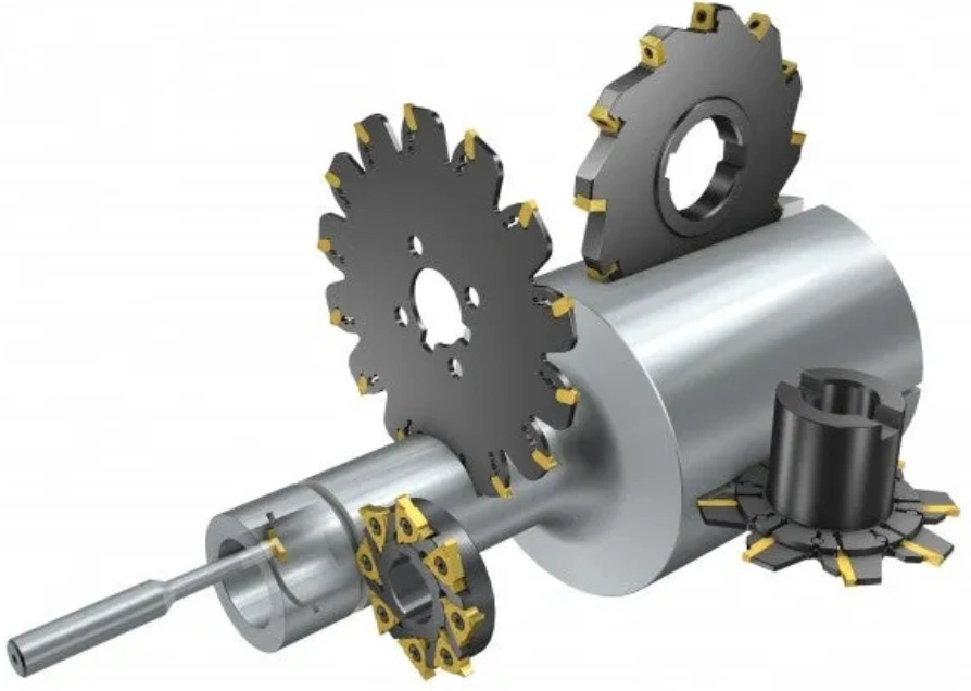 Multiple carbide-insert slot milling cutters of varying sizes mounted on an arbor on a white background
