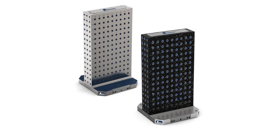 Two vertical modular tombstone blocks, one in silver steel and one in black material, displaying grid patterns of mounting holes against a white background.