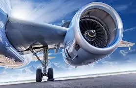 Modern aircraft engine with visible turbine blades and landing gear