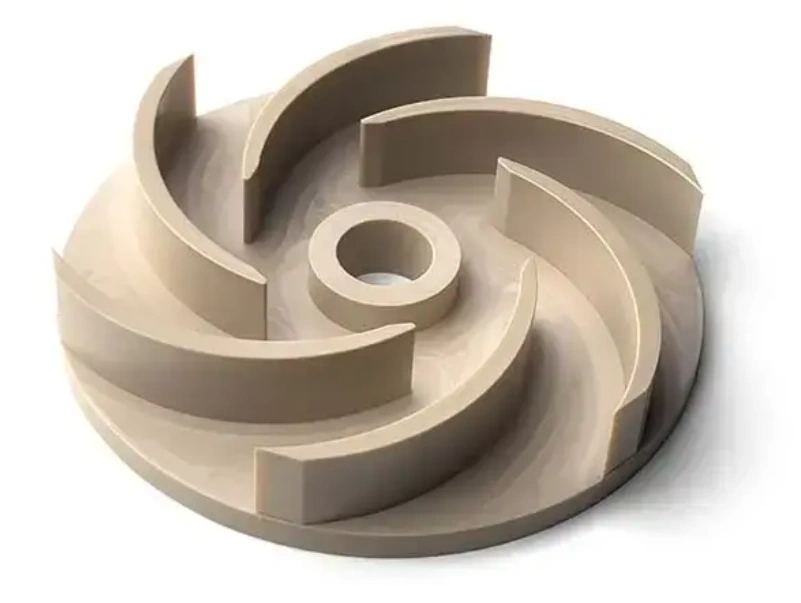 CNC-machined PEEK plastic impeller with curved vanes on a white background.