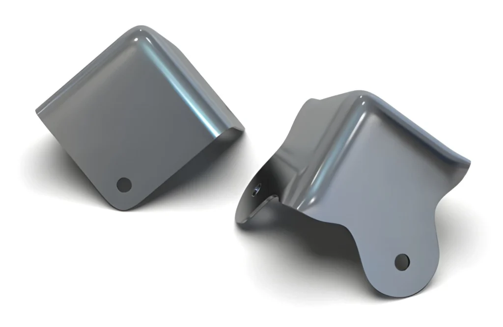 Close-up of polished flat metal corner brackets for assembly use.