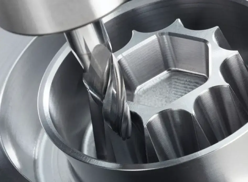 End mill machining a deep-angled pocket with scalloped walls inside a circular metal workpiece. 