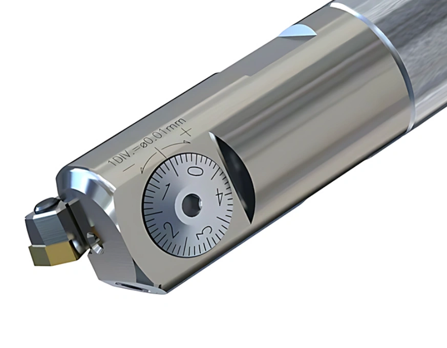 Close-up of a precision boring head with a carbide insert and micrometer adjustment dial