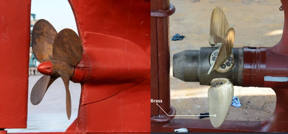 A side-by-side comparison of a rusted steel ship propeller and a clean brass propeller, demonstrating superior marine corrosion resistance.