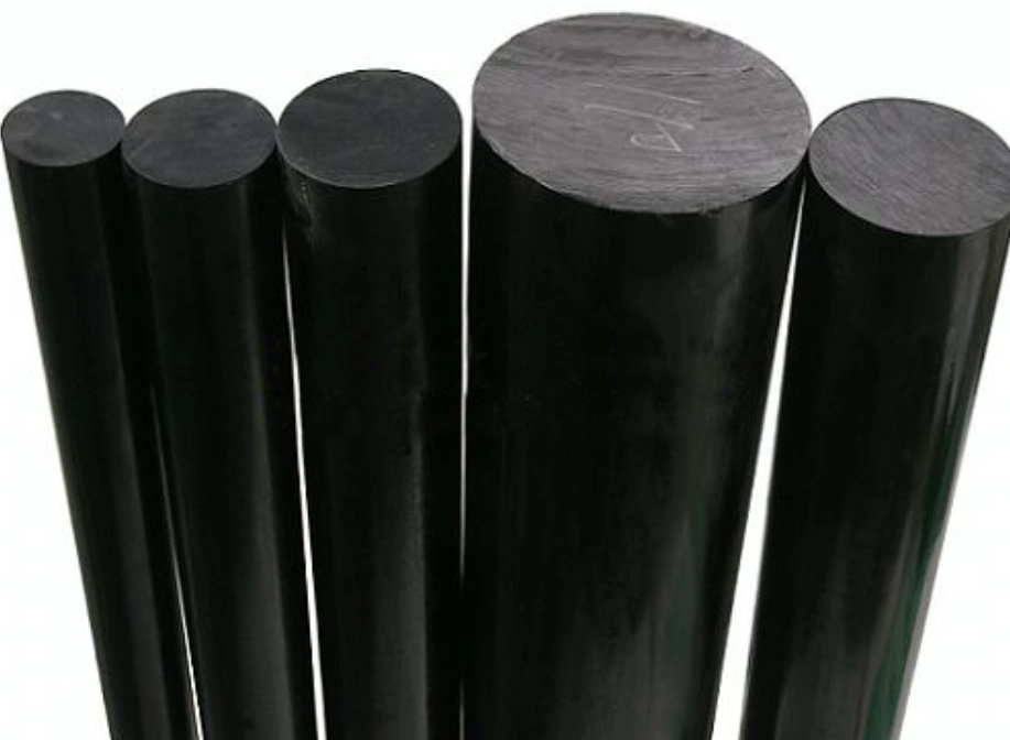 Five black carbon-filled PTFE rods of varying diameters standing upright