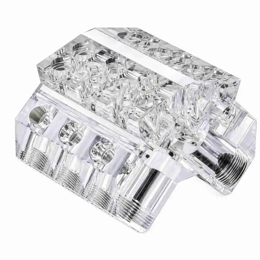 CNC machined acrylic block with threaded ports