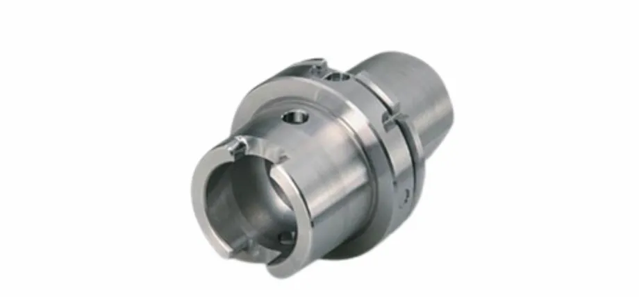 A precision-machined industrial stainless steel component featuring cylindrical bores and a smooth metallic luster.