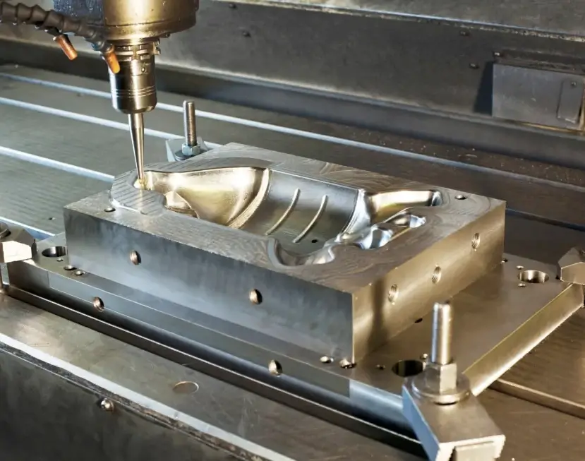 CNC mill machining a contoured injection mold die cavity