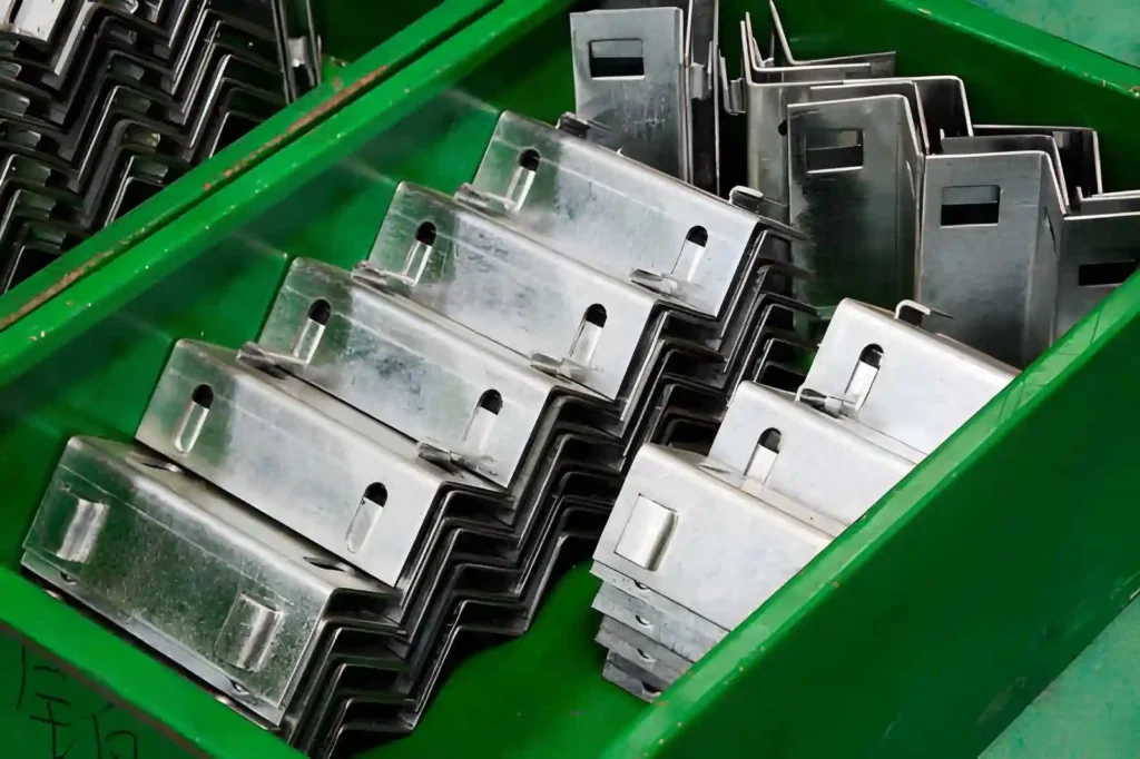 Neatly arranged stainless steel bent metal components placed in an organized layout.