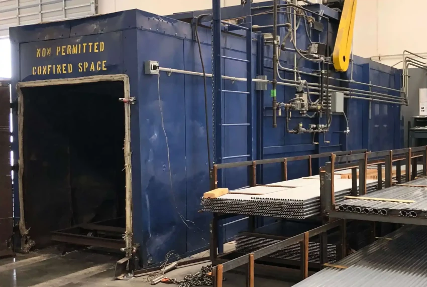Industrial aging oven for aluminum extrusions with racked profiles ready for heat treatment  
