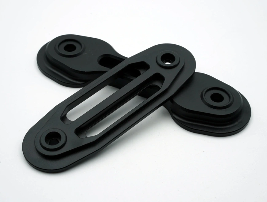 Black anodized 6061 aluminum mounting brackets with slotted and countersunk holes