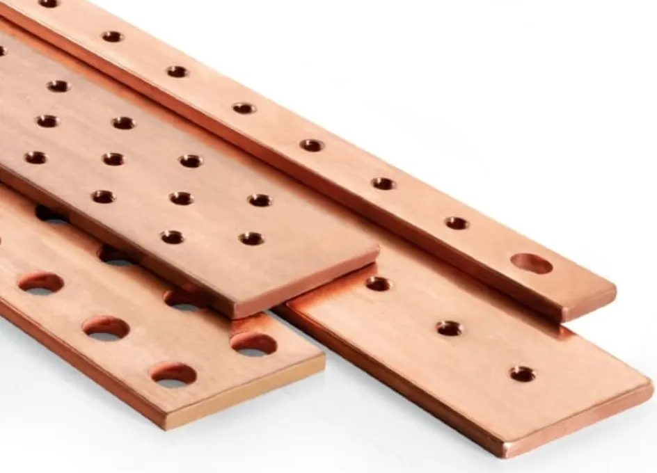 Stack of laser-cut copper busbars with precision mounting holes of varying diameters