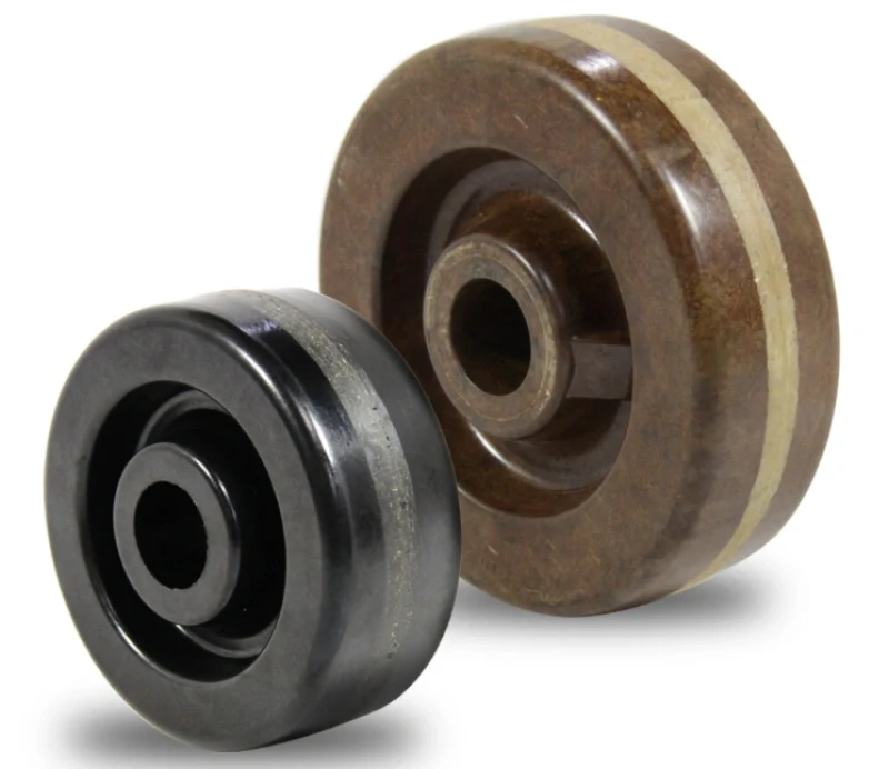 Two phenolic resin wheels with keyed center bores, black and brown