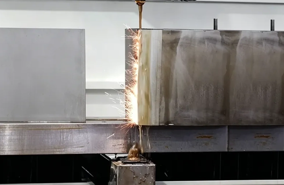 Close-up of EDM wire cutting through metal block, sparks flying with dielectric fluid streaming down